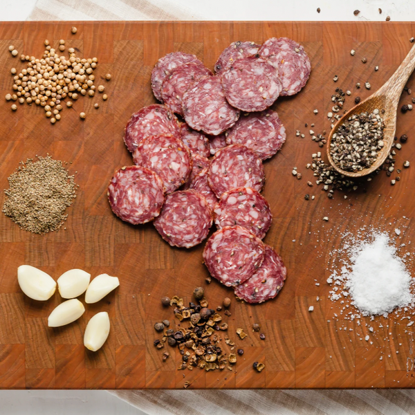 bison landjaeger salami slices on board with ingredients