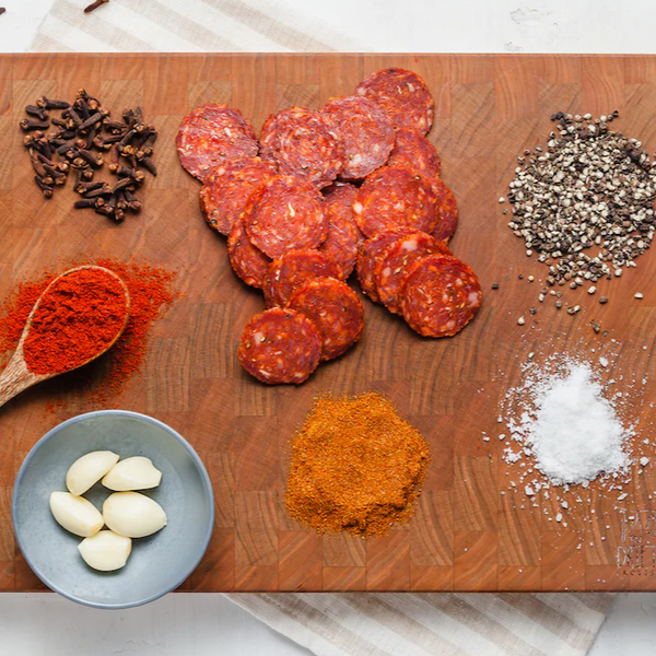salami chorizo slices on board with ingredients