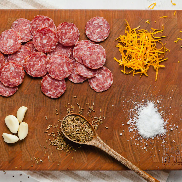 salami loukanika slices on board with ingredients