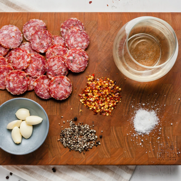salami sopressata slices on board with ingredients