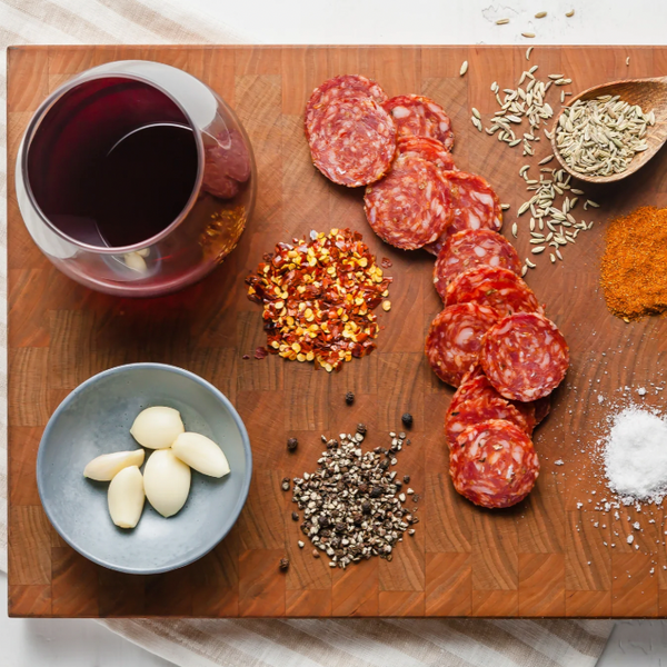 salami spicy finnochiona slices on board with ingredients